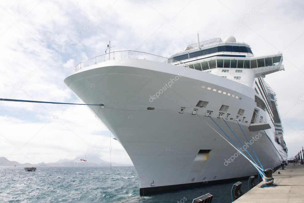 Massive White Cruise Ship Tied to Bollard on Pier