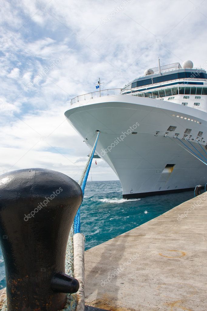 Massive White Cruise Ship Tied to Black Bollard on Pier