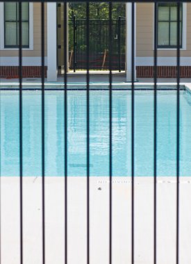 Pool Through Iron Fence clipart