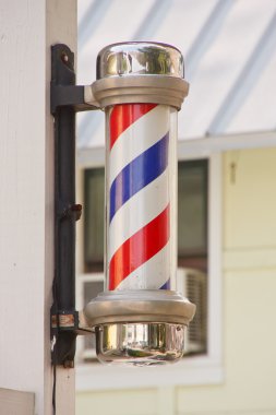 Classic Barber Pole on Wood Post clipart