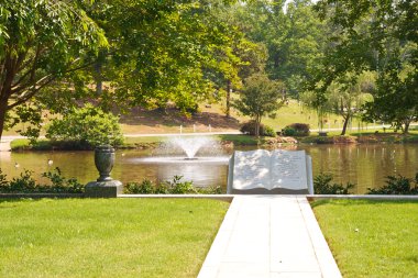 Lake in Cemetery with Bible Sculpture clipart