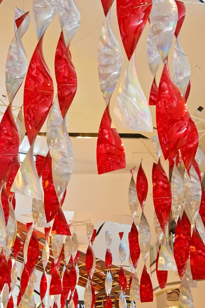 Red and White Ribbons Hanging from Ceiling — Stock Photo, Image