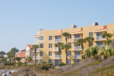 Yellow Stucco Condo Beyond Tropical Beach