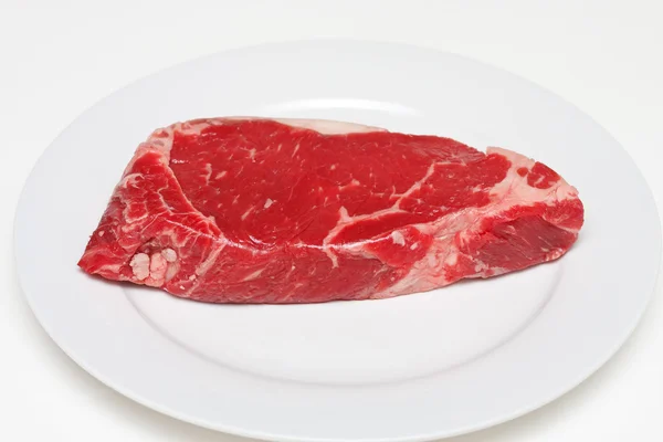 Fresh Strip Steak on a White Plate — Stock Photo, Image