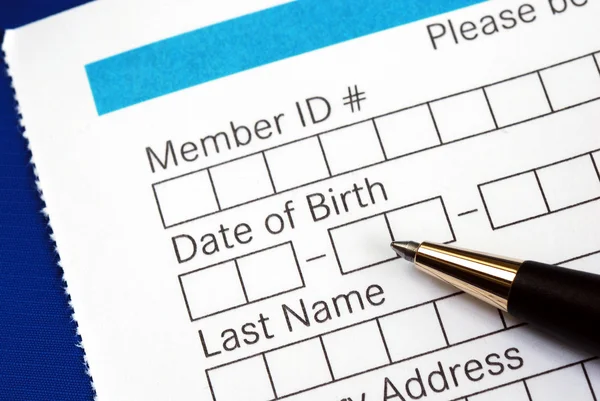 Fill in the personal information in the form isolated on blue Stock Photo