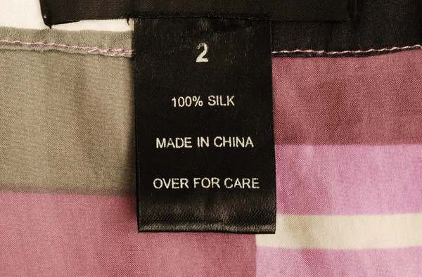 Vista de cerca de la etiqueta de la ropa — Foto de Stock