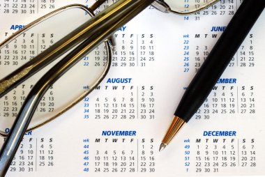 Check out the dates in a business calendar concepts of planning ahead clipart