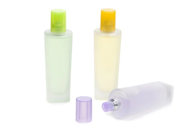 Три парфюмерные бутылки — стоковое фото