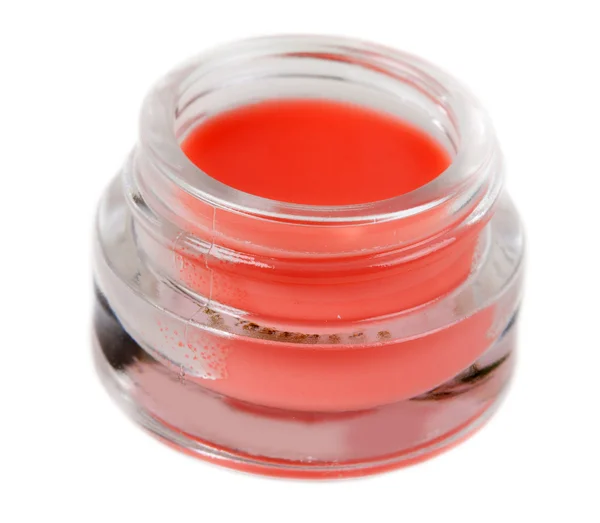 Röd bank med en kosmetisk kräm — Stockfoto