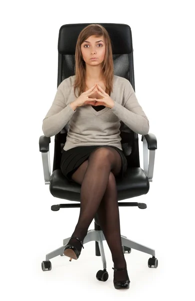 Menina sentada em uma cadeira — Fotografia de Stock