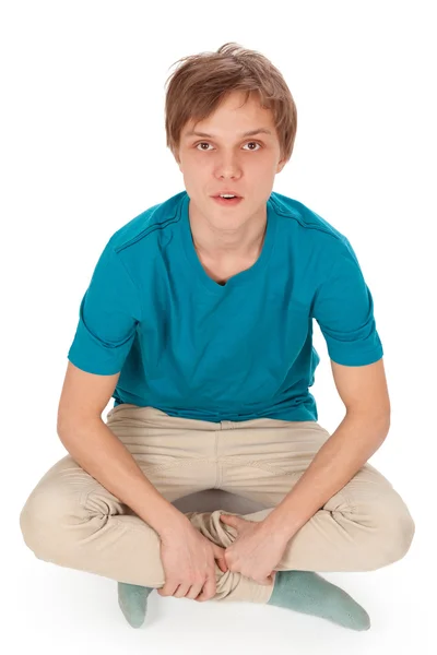 Adolescente se senta no chão — Fotografia de Stock