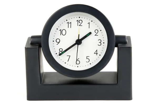 Desktop orologio meccanico in un involucro di plastica nera Fotografia Stock