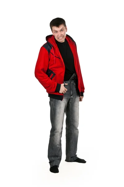 Jonge thug in een rode trui met een pistool — Stockfoto