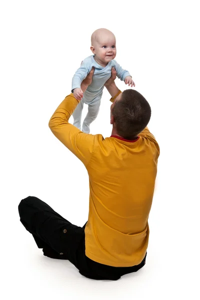 Dad tosses baby — Stock Photo, Image