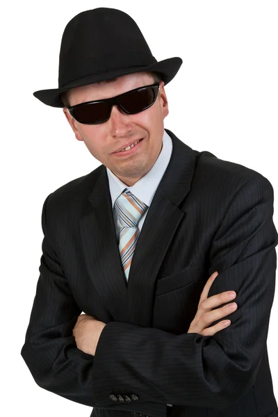 Бизнесмен в темных очках и шляпе — стоковое фото