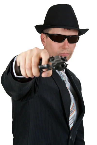 Επιχειρηματία σε ένα καπέλο και γυαλιά ηλίου με ένα πυροβόλο όπλο — Φωτογραφία Αρχείου