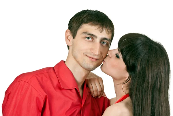 Woman kisses a man on the cheek — Stock Photo, Image