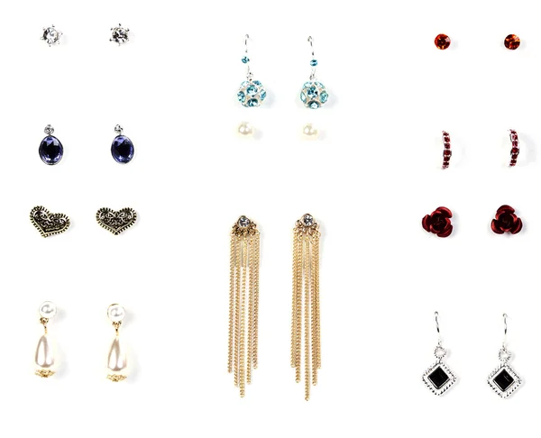Several pairs of earrings with stones — Stock Photo, Image