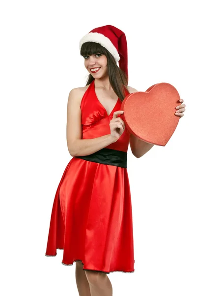 Kırmızı elbiseli kız santa şapka — Stok fotoğraf