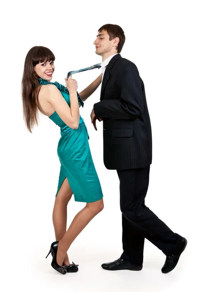 Mädchen hält Geschäftsmann in Krawatte — Stockfoto
