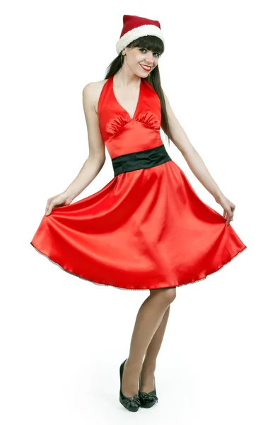 Meisje in een rode jurk en hoed santa — Stockfoto