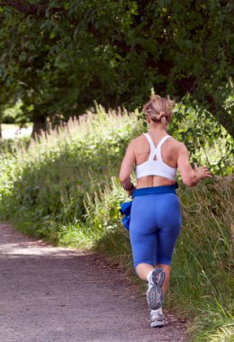 Fat woman running around in the park clipart