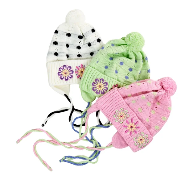 Tři barevné dětské pletené čepice s květinový vzor — Stock fotografie