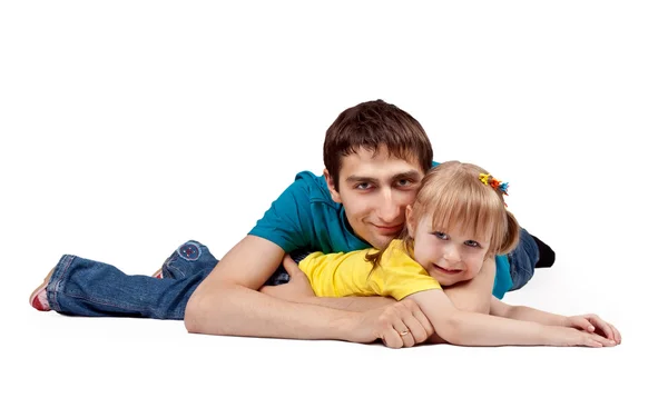 Papá y su hijita tirados en el suelo — Foto de Stock