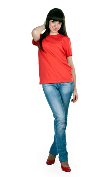 Girl in red shoes and blue jeans in the studio — Stock Photo, Image