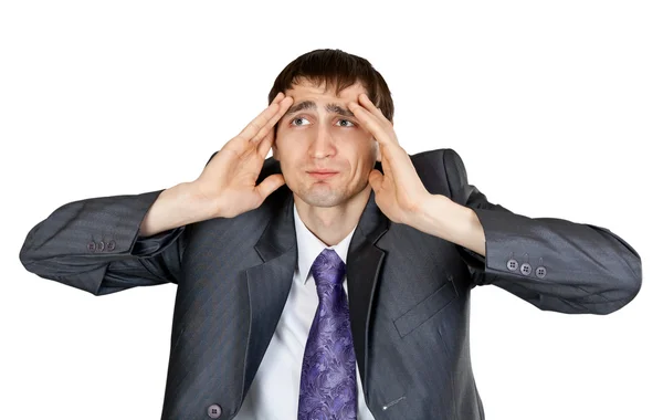 Empresário em um terno cinza com uma dor de cabeça no estúdio — Fotografia de Stock