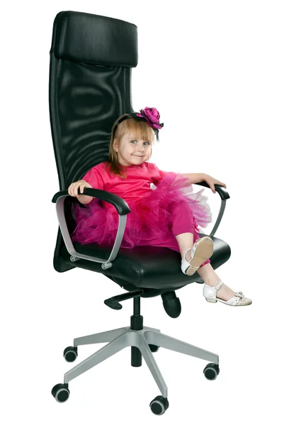 Little girl in an office chair black — Stock Photo, Image