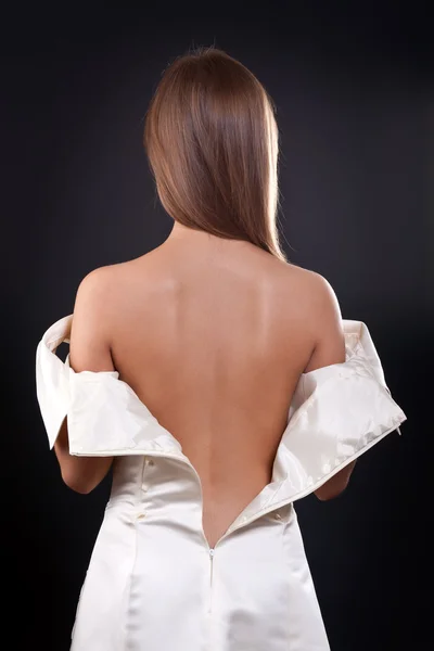 Pretty girl with bare back in the studio — Stock Photo, Image