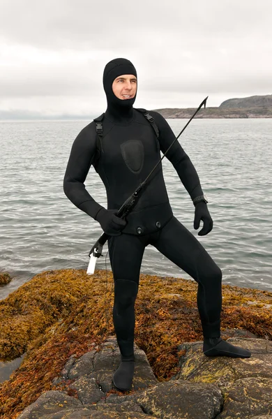 stock image Freediver in a diving suit on the Barents Sea