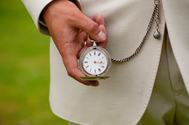 Old watch in the hands. clipart