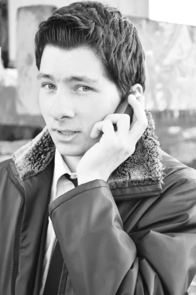 Young man speaking on a phone — Stock Photo, Image