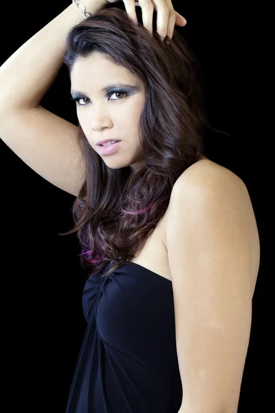 Young hispanic woman unwelcoming expression black dress — Stock Photo, Image