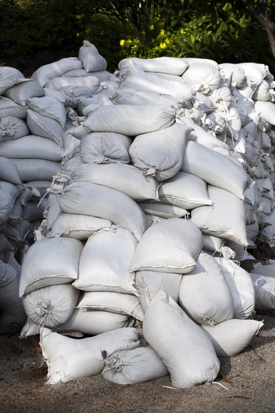 stock image Pile of white cloth sand bags waiting for emergency