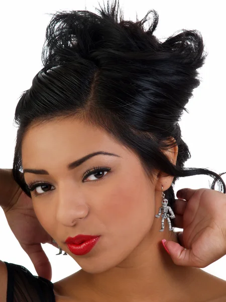 Young hispanic woman portrait with skeleton earrings — Stock Photo, Image