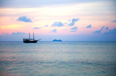 Pirate boat at sunset in Cozumel, Mexico. clipart