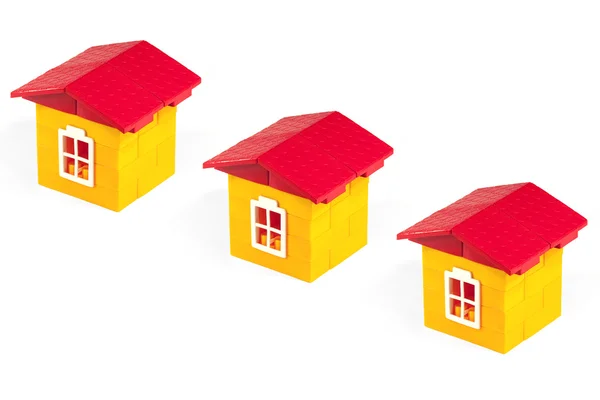 Три домика для игрушек — стоковое фото