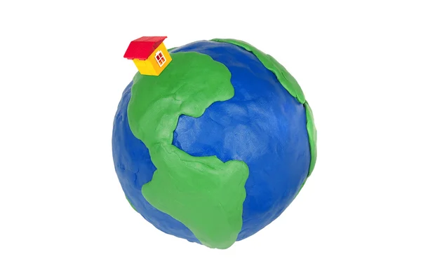Toy house on the globe — Stock Photo, Image