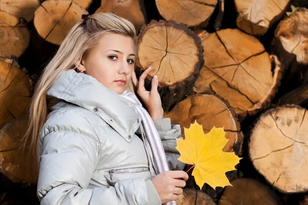 Girl with maple leaf — Stock Photo, Image