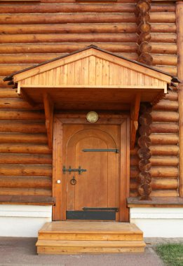 Entrance into a wooden house clipart