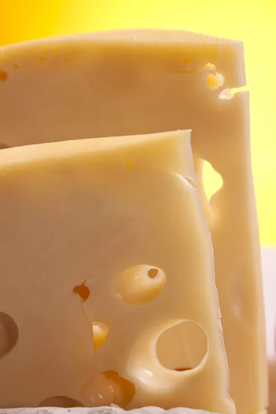 stock image Cheese, wine and other tasty stuff on wooden table