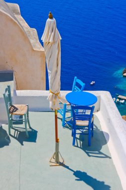 Magic terrace in Santorini with Caldera view clipart