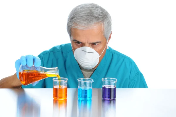 Scientist Pouring Liquids into Beakers — Stock Photo, Image