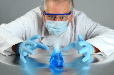 Mad scientist observes his experiment clipart