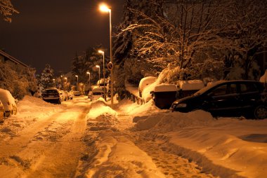 Winter street at night on long exposure clipart