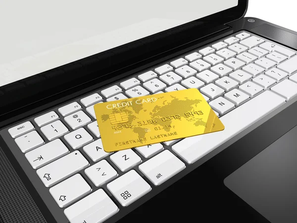 Gold kreditkort på laptop — Stockfoto