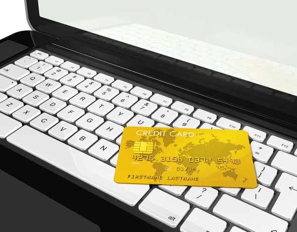 Gold-Kreditkarte auf Laptop — Stockfoto